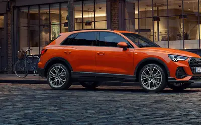Audi Q3 side profile in an urban setting