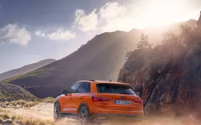 Audi Q3 rear three-quarter view on a mountain road