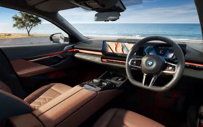 BMW i5 driver cockpit with curved display