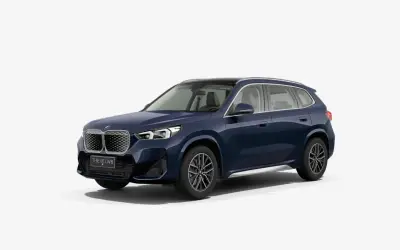 BMW iX1 front three-quarter studio render