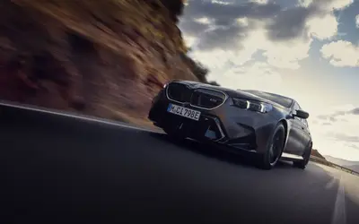 BMW M5 front three-quarter view on the move