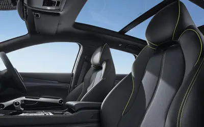 BYD Atto 3 interior view of the front seats and panoramic sunroof