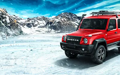 Force Gurkha three-door front three-quarter view in red on ice