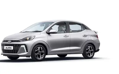 Hyundai Aura front three-quarter view in silver