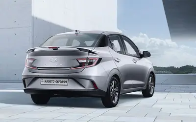 Hyundai Aura rear three-quarter view in silver