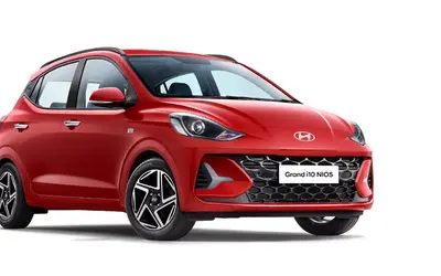 Hyundai Grand i10 Nios front three-quarter view in red