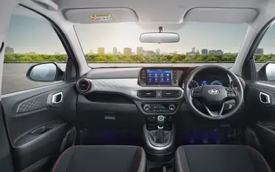 Hyundai Grand i10 Nios sporty black interior with red inserts, dashboard view