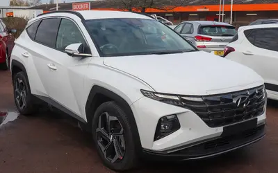 Hyundai Tucson front three-quarter view in white