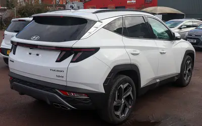 Hyundai Tucson rear three-quarter view in white