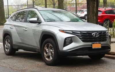 Hyundai Tucson front three-quarter view in silver