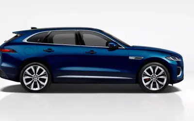 Jaguar F-Pace side profile studio view in dark blue