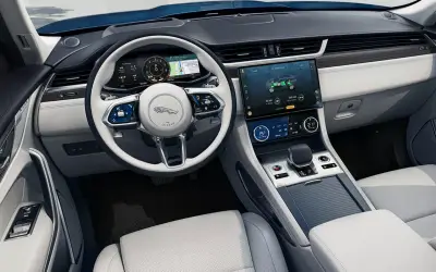 Jaguar F-Pace dashboard with the Pivi Pro touchscreen and light interior trim