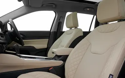 Jeep Meridian interior view of the front seats and dashboard in beige leather