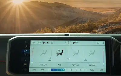 Jeep Wrangler interior view of the Uconnect touchscreen and climate controls