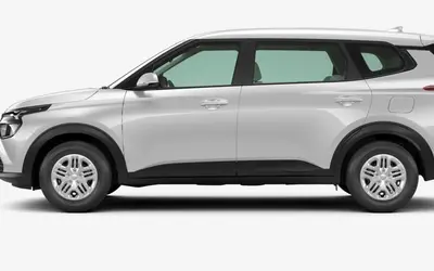 Kia Carens side profile in Clear White