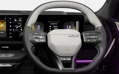 Kia Seltos dashboard with steering wheel and panoramic touchscreen