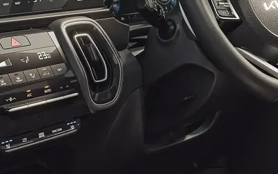 Kia Sonet dashboard close-up showing touchscreen and automatic climate control