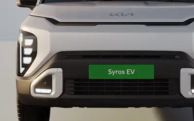 Kia Syros EV front view with closed-off grille and triple-stack LED lighting