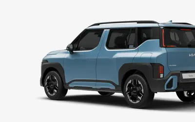 Kia Syros rear three-quarter view in Frost Blue
