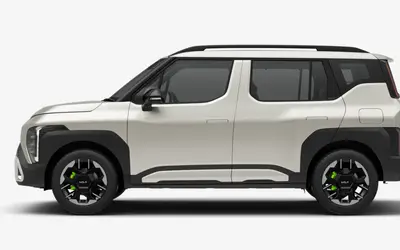 Kia Syros side profile in Ivory Silver Gloss