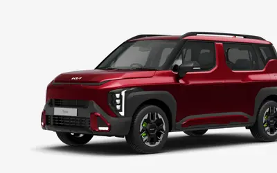 Kia Syros front three-quarter view in Magma Red