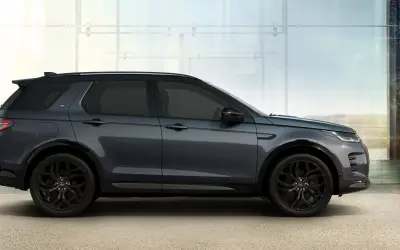 Land Rover Discovery Sport rear three-quarter studio view in dark blue