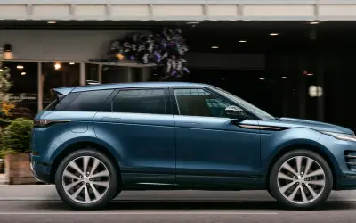 Range Rover Evoque side profile in blue on a city street
