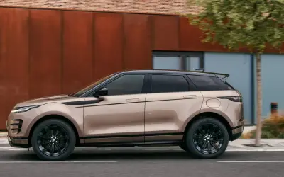 Range Rover Evoque side profile in bronze against a corten-steel wall