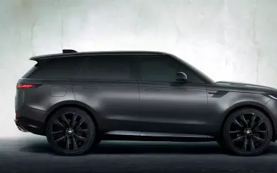 Range Rover Sport side profile studio view in dark grey