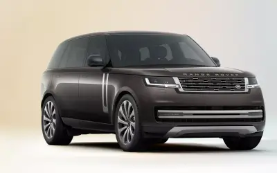 Range Rover front three-quarter studio view in dark grey