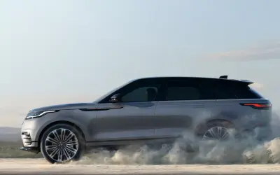 Range Rover Velar in motion on a gravel surface