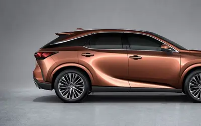 Lexus RX side profile studio view in copper