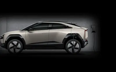 Mahindra BE 6 side profile at a charging point