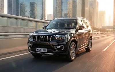 Mahindra Scorpio-N in black driving on a city highway
