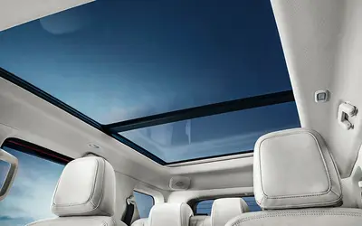 Mahindra Thar Roxx cabin showing panoramic sunroof and rear seats