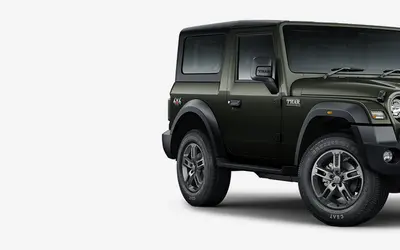 Mahindra Thar LX front three-quarter view in Deep Forest green