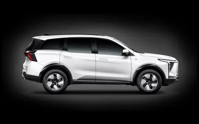 Mahindra XEV 9S side profile studio shot in Everest White