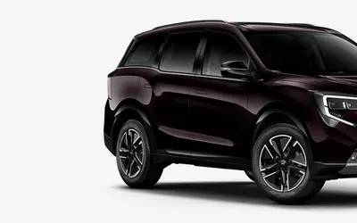 Mahindra XUV 7XO front three-quarter view in Ruby Velvet