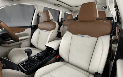 Mahindra XUV 7XO front seats in white and tan leatherette upholstery
