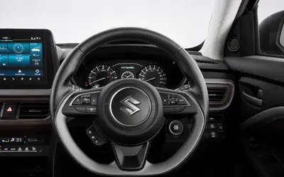 Maruti Brezza dashboard with flat-bottom steering wheel and touchscreen