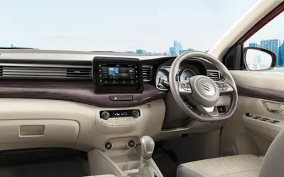 Maruti Ertiga dashboard with wood-finish trim and steering wheel