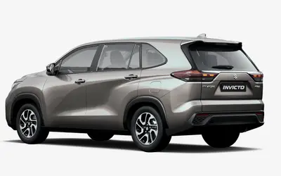 Maruti Invicto rear three-quarter view in Stellar Bronze
