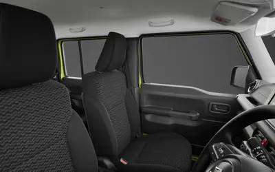 Maruti Jimny interior with front seats and dashboard