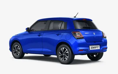 Maruti Swift rear three-quarter view in Luster Blue
