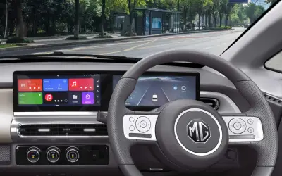 MG Comet EV driver view of steering wheel, digital cluster and infotainment screen