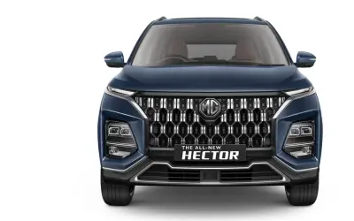 MG Hector head-on front view in Celadon Blue showing Aura-Hex diamond grille