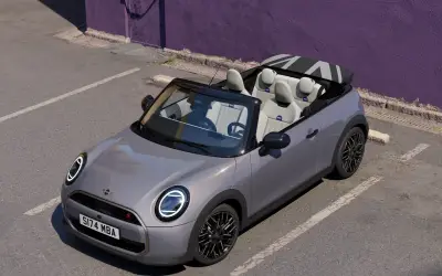 MINI Cooper Convertible in grey with the roof down, front three-quarter view