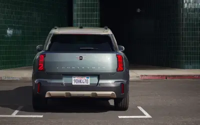 MINI Countryman in grey-green, rear view showing the tail lights and Countryman lettering
