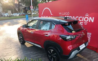 Nissan Magnite rear three-quarter view in red