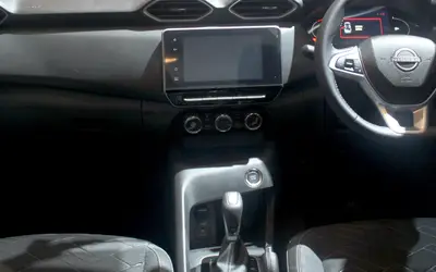 Nissan Magnite dashboard with touchscreen, steering wheel and centre console (cropped)